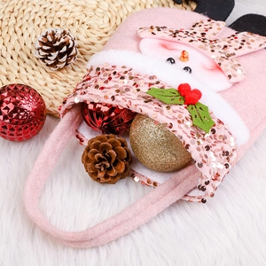 Pink felt Christmas gift bag with sequin snowman, holiday ornaments and pine cones