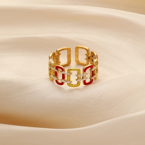 Detailed macro view of an adjustable gold geometric ring with colorful enamel inlay