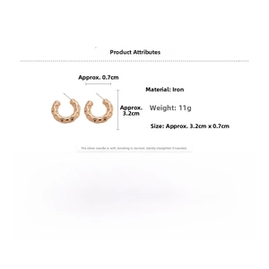 Detail view of golden C-shaped textured earrings with dimensions and material specs