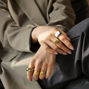 Set of five 18K gold and silver chunky stainless steel rings in organic lava and twisted styles