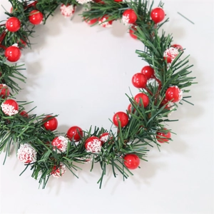 Artificial Christmas candle ring with frosted red berries and green pine needles