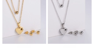 Detail of titanium steel jewelry sets with LOVE heart pendants in gold and silver