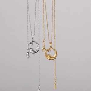 Minimalist stainless steel wave pendant necklace set in polished gold and silver finishes