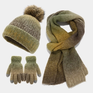 Detail of winter tie-dye knit set showing gradient earth tones scarf, hat and gloves