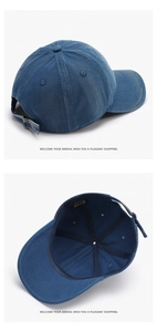 Detail of washed navy denim baseball cap showing distressed texture and metal buckle strap