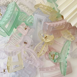 Close-up of assorted matte candy-colored square claw clips in a stylish stack