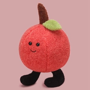 Cute apple plush toy with green leaf and dangling legs on pink background