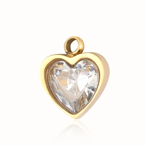 Detailed close-up of a heart-shaped gold pendant with a central white shell eye inlay