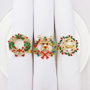 Set of 3 Christmas napkin rings with reindeer and wreath designs in gold and rhinestones