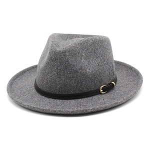 Close-up of grey felt fedora featuring letter embroidery and black leather belt band