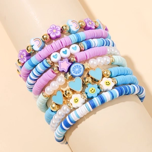 Detailed layered bracelet set with sky blue heishi beads and flower heart charms