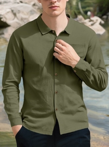 Close-up of army green linen shirt showing waffle texture and buttoned collar detail