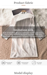 Detailed close-up of champagne satin bathrobe with washing instructions and texture detail