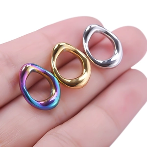 Three irregular oval 304 stainless steel rings in rainbow, gold, and silver finishes