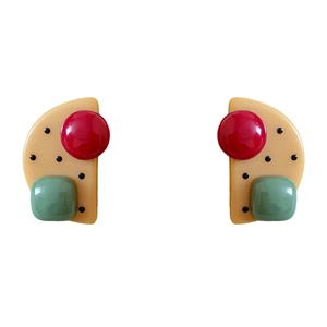 Colorful resin geometric earrings with polka dots on a clean white background