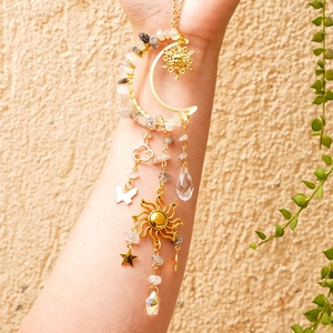 Detailed suncatcher view with natural crystal stones and celestial moon star pendants