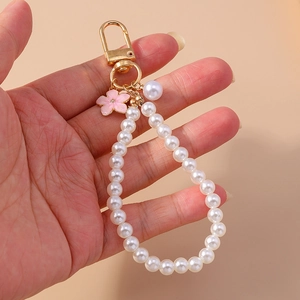 Elegant pearl bead keychain with pink flower charm and golden clasp for women accessories