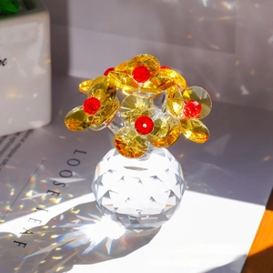 Close-up of a faceted crystal flower bouquet in a transparent glass vase with soft lighting