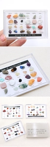 Macro detail of 24 natural gemstones and crystal specimens with English name labels