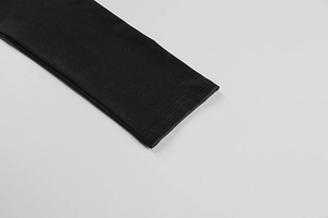 Close-up of double-needle reinforced stitching on high-elastic black yoga jumpsuit fabric