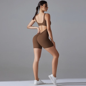 Detail view of the brown athletic romper featuring a U-back design and scrunch butt effect