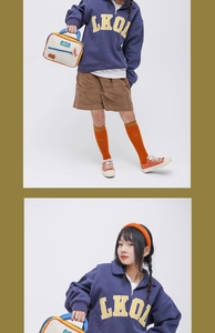 Close-up of stylish navy blue graphic hoodie and corduroy shorts with colorful accessories