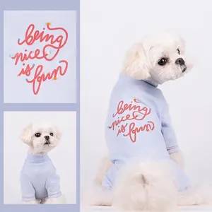 Light blue dog turtleneck sweater with red embroidery text and cozy knit cotton fabric