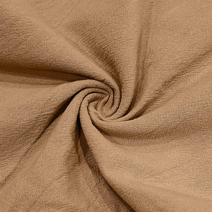 Detailed macro view of khaki cotton linen fabric with natural wrinkled texture and weave