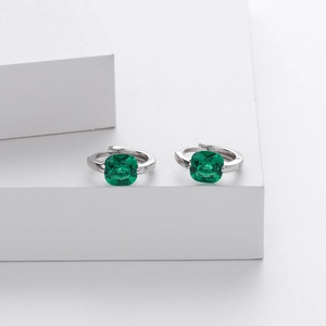 Detailed close-up of S925 silver hoop earrings with square emerald zircon stones on stones
