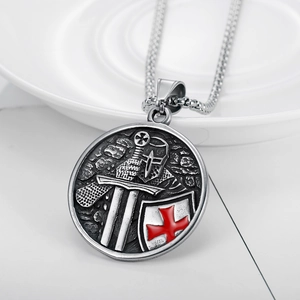 Crusader Knight shield necklace with sword and red cross pendant on ceramic surface