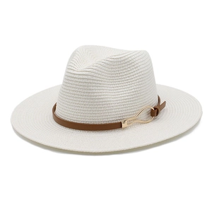 Macro detail of white woven straw fedora hat with brown leather band and gold metal buckle