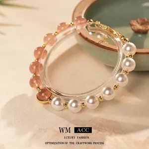 Elegant strawberry quartz and pearl beaded bracelet with gold accents for women