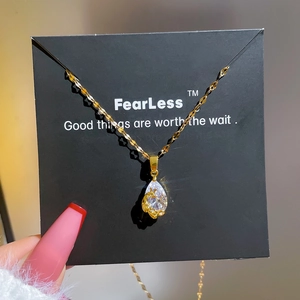 Titanium steel necklace featuring a water-drop zircon pendant with gold floral detailing