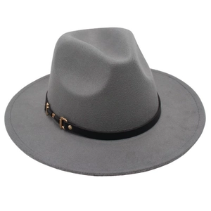 Detailed macro view of a grey felt fedora featuring a black leather band and gold buckle