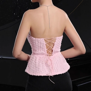 Close-up of pink textured rose pattern backless top with adjustable lace-up straps