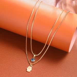 Double-layer Hamsa Hand and Evil Eye pendant necklace set on golden box chain