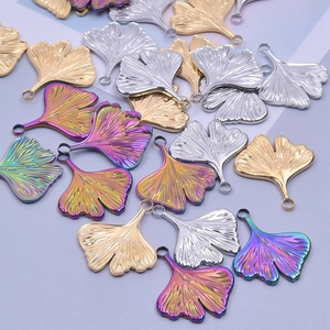 Detailed view of ginkgo leaf pendants with fine veins in gold, silver and rainbow finish
