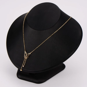 Elegant gold butterfly pendant necklace with 3D hollow design on a black bust display