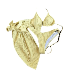 Three-piece light yellow bikini set with backless drawstring top and matching sarong skirt