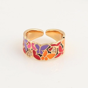 Detailed view of enamel butterfly ring with gold plating and cubic zirconia accents