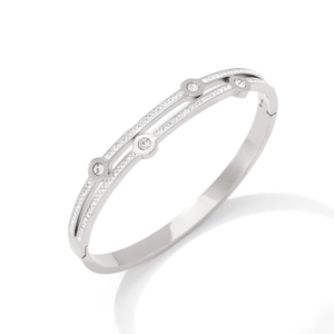 Silver geometric double-layered bangle with sparkling zircon stones on a clean background
