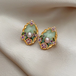 French vintage gold earrings with green enamel, purple floral accents and white pearl