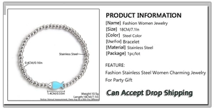 Detail of 4mm stainless steel bead bracelet with a light blue enamel fish pendant charm