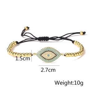Detail of the 18K gold-plated Evil Eye charm with size annotations and black cord
