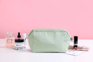Mint green waterproof cosmetic bag with side handle and top zipper for travel