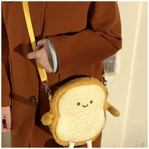 Cute toast bread plush crossbody bag with smiling face and yellow adjustable strap