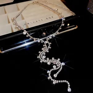 Luxurious Y-shaped tassel necklace with sparkling rhinestones on a black background