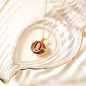 Elegant gold stainless steel necklace with a colorful Virgin Mary crystal pendant detail