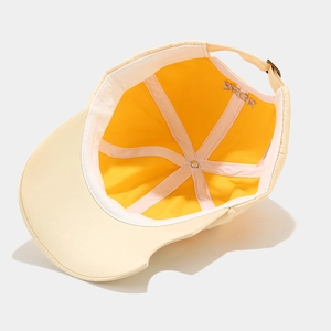 Detail view of two-tone baseball cap with interior sweatband and metal adjustment buckle