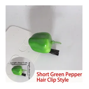 Detail view of a 5cm green pepper hair clip with size measurements on white card